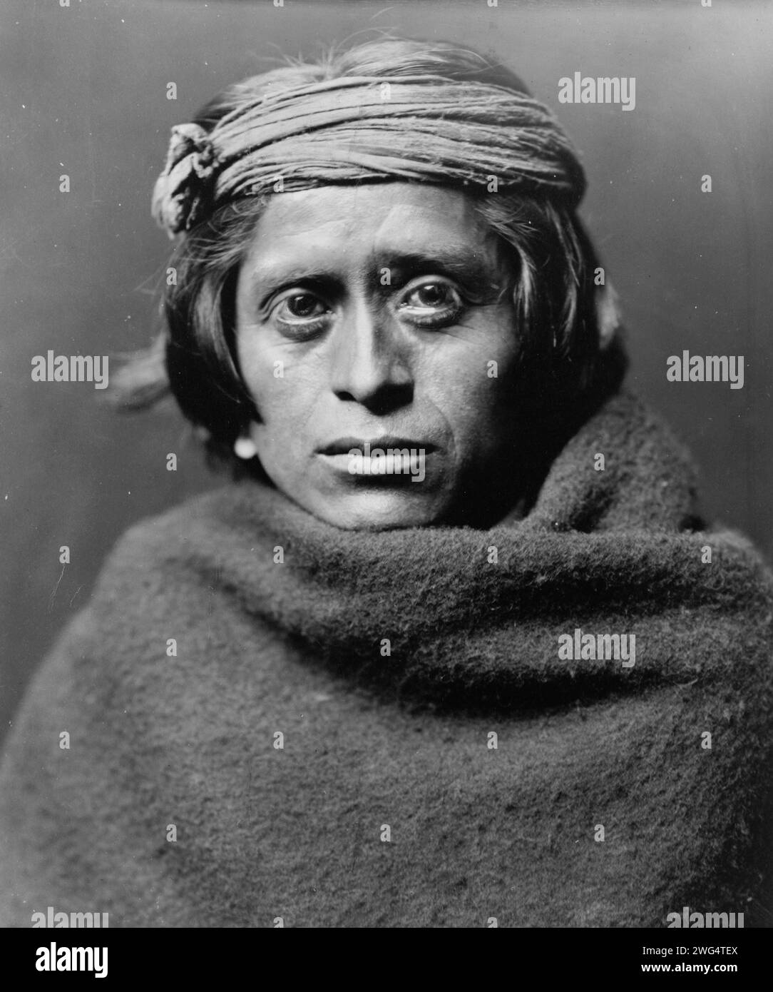 A Zuni man, c1903. Zuni man wearing ragged headband and blanket Stock