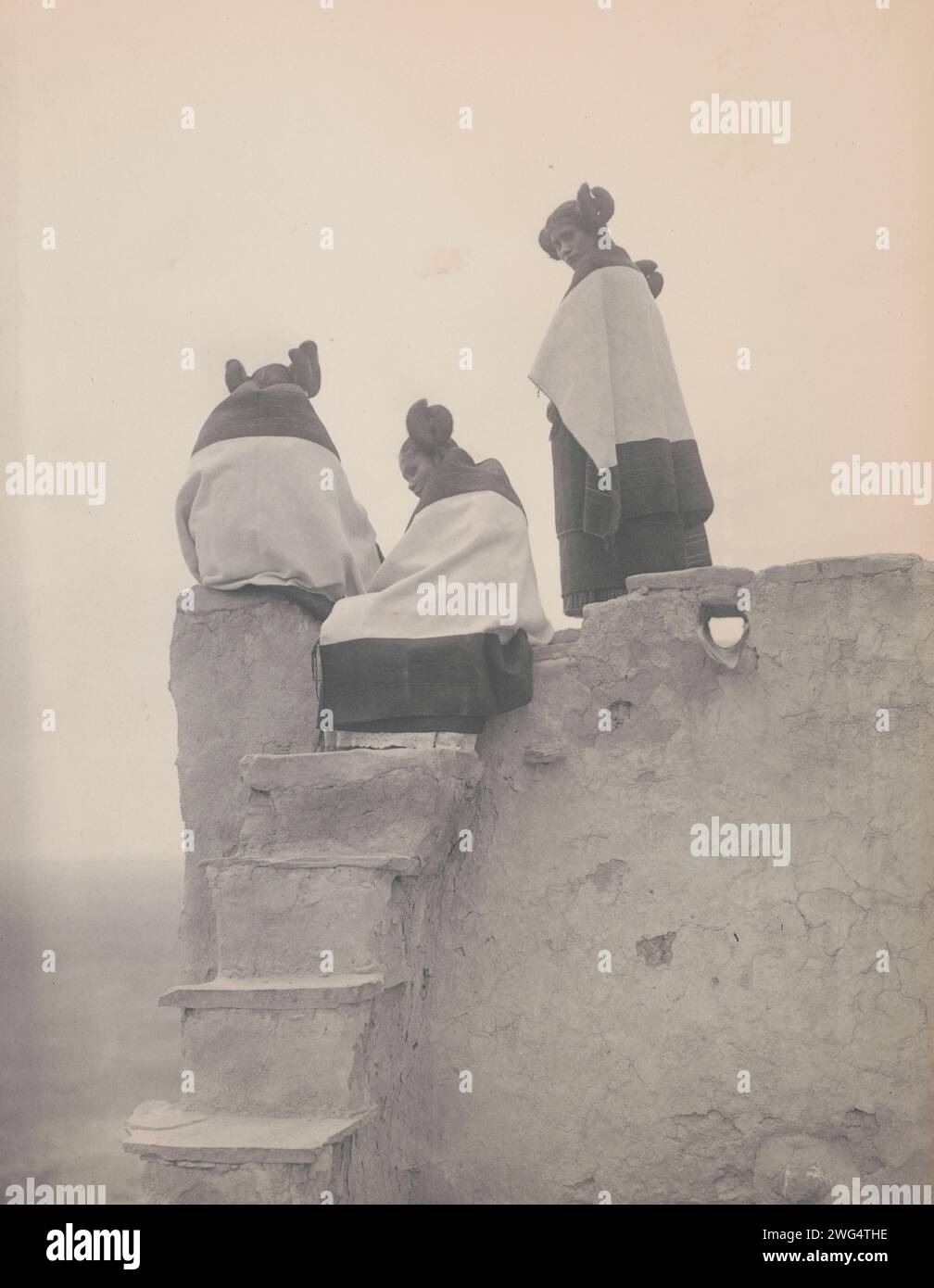 Three Hopi women at top of adobe steps, New Mexico, 1906, c1906. Stock Photo