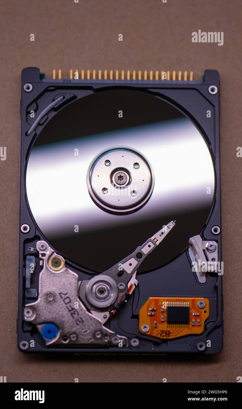 Mechanics inside a hard disk drive with platter and read write head Stock Photo