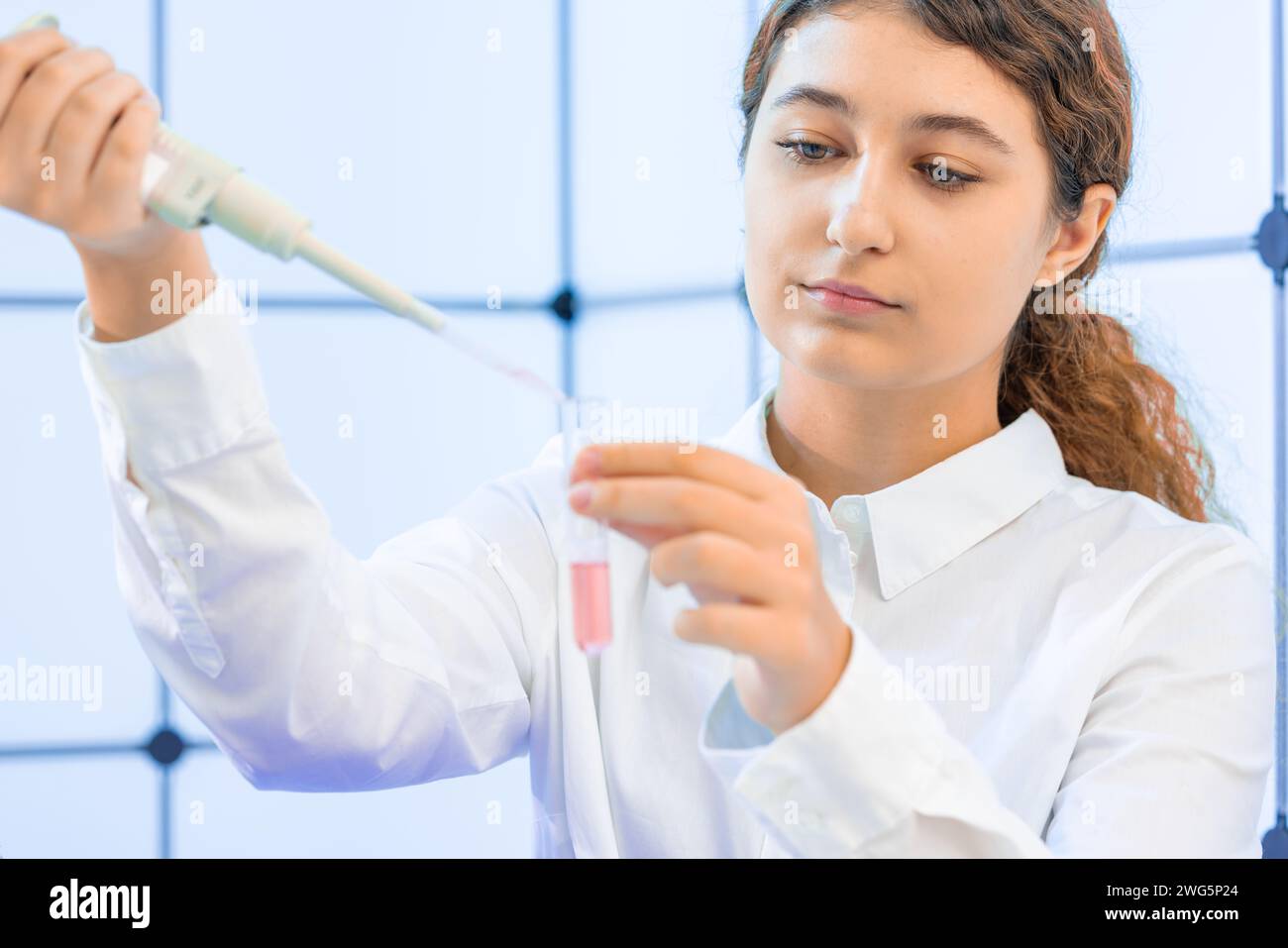 Female Scientist Conducting Scientific Experiment in Laboratory Stock Photo