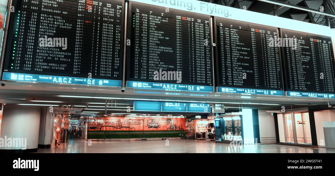 airport display with flight schedules and times Stock Photo