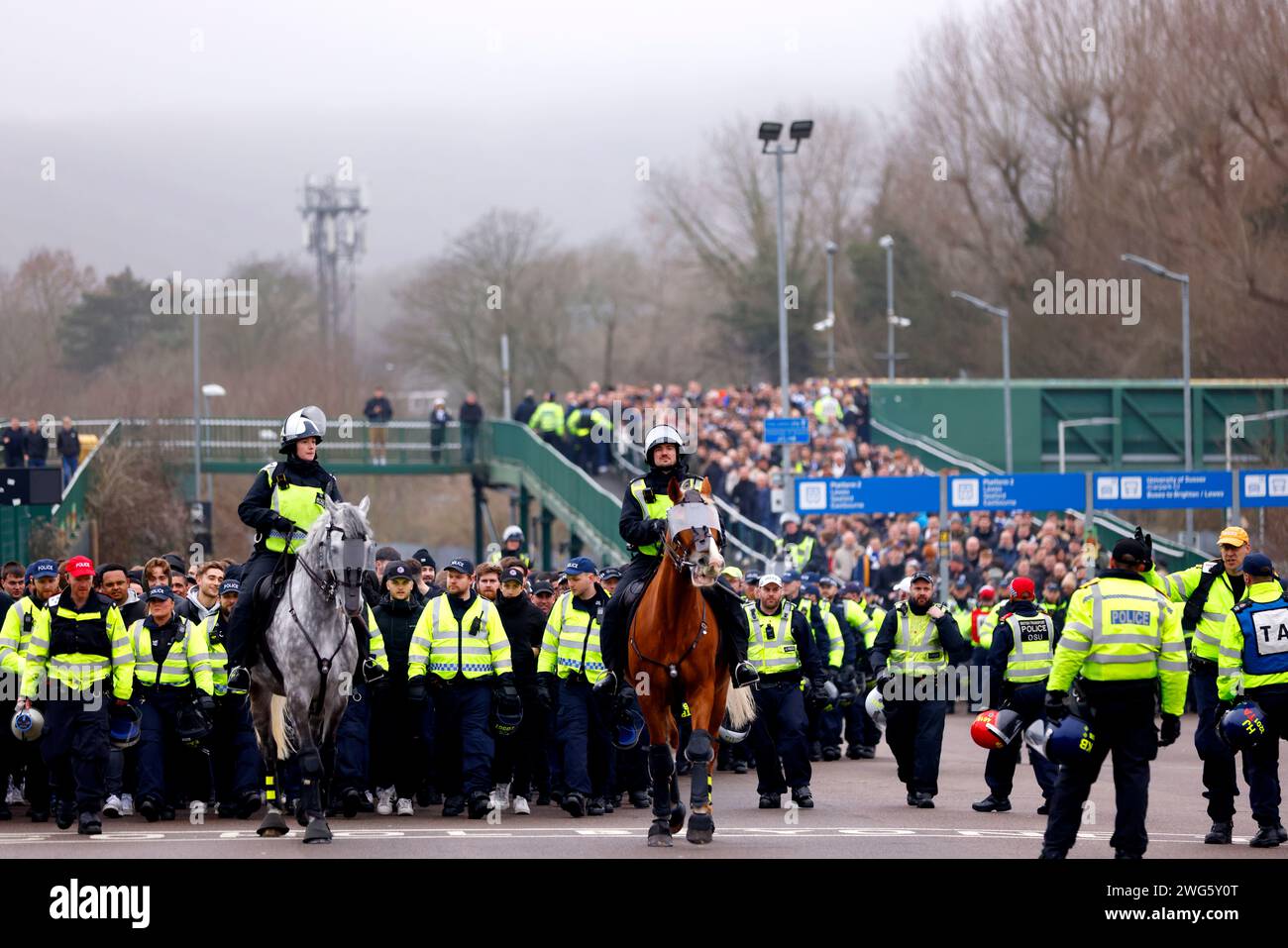 Police officers escort Crystal Palace fans to the stadium ahead of the ...