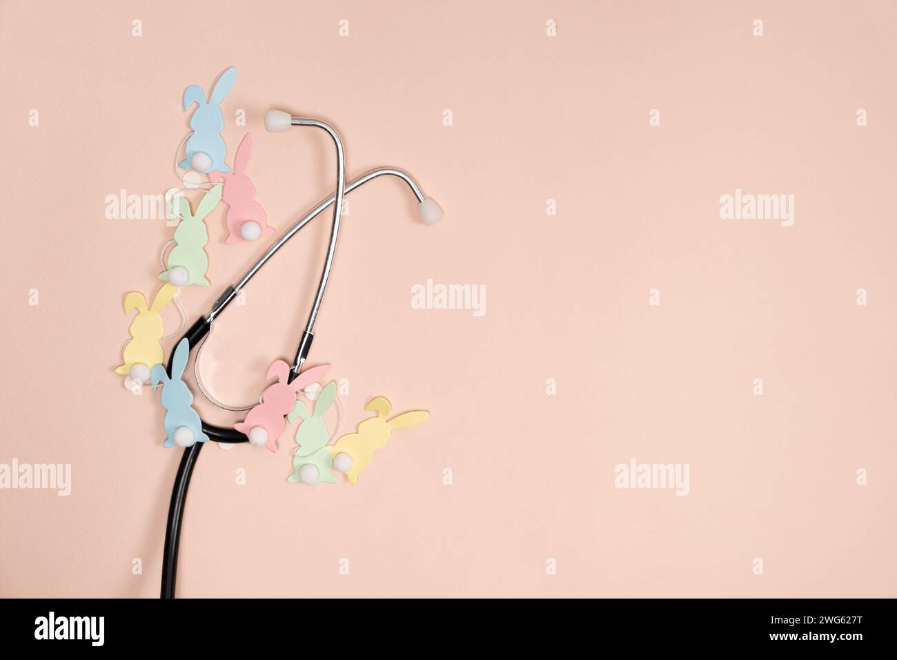 Medical Easter banner on peach color background, blank with space for text, top view. Stock Photo