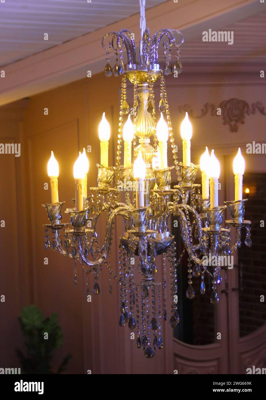 Hanging ceiling chandelier with gold and crystal decoration in classic vintage interior Stock Photo