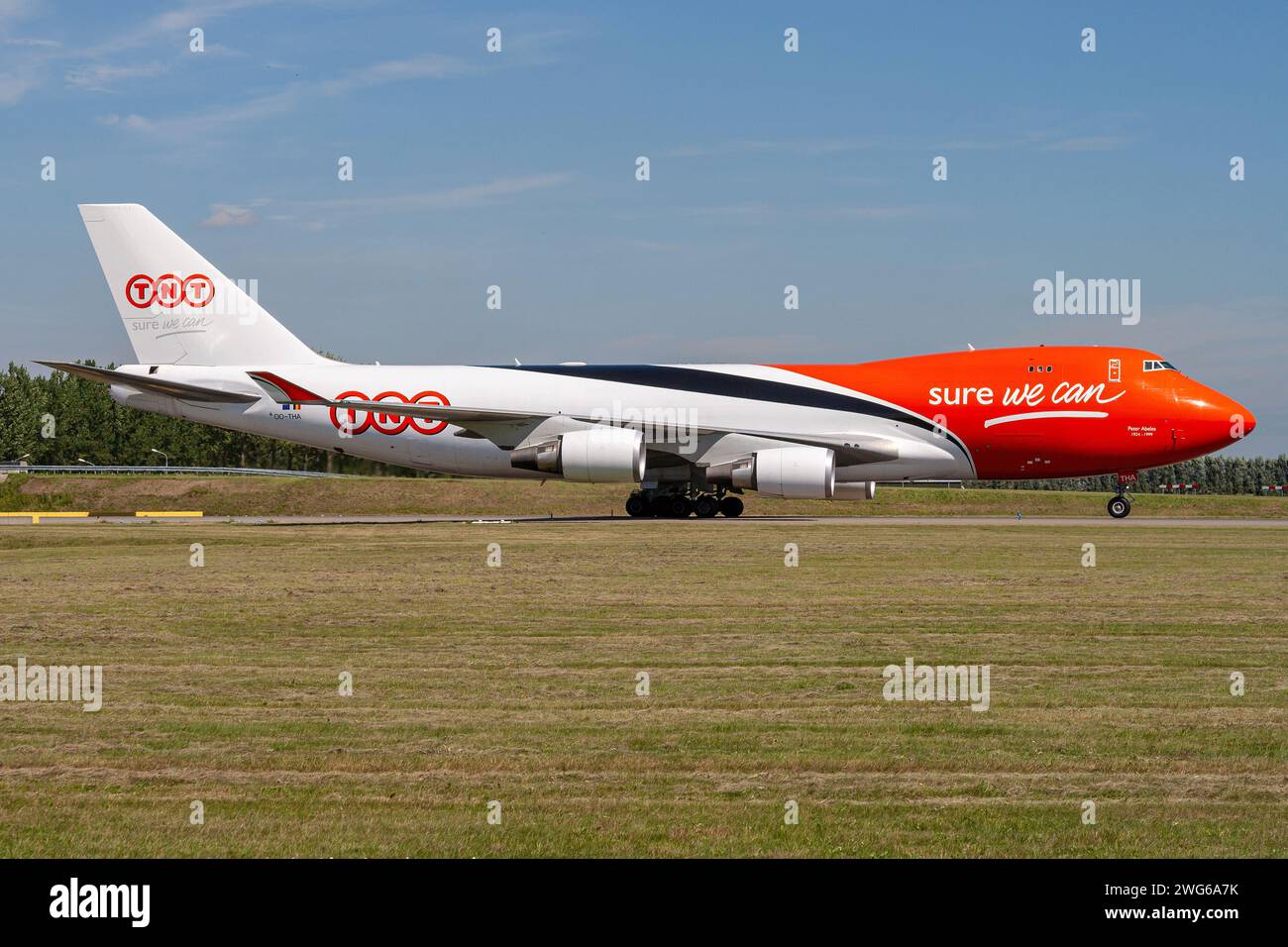 TNT Airways Boeing 747-400F with registration OO-THA rolling on taxiway V of Amsterdam Airport Schiphol Stock Photo