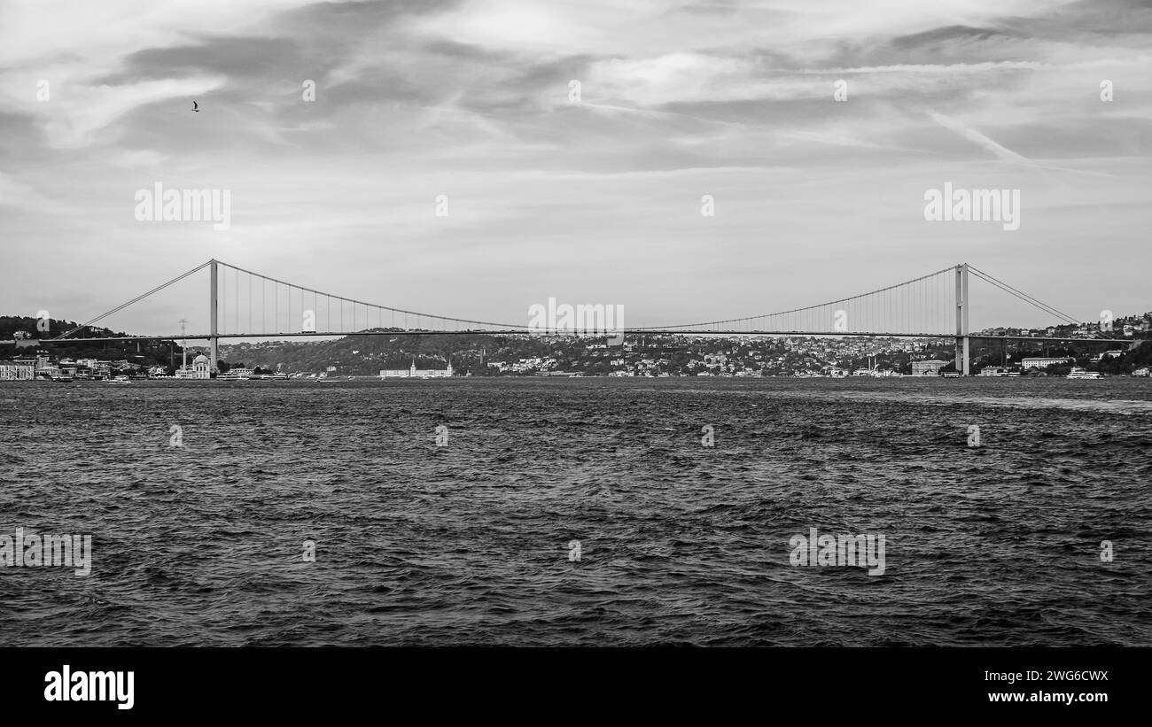 the red bridge in Istanbul photographed from a ferry while crossing the Bosphorus Strait Stock Photo