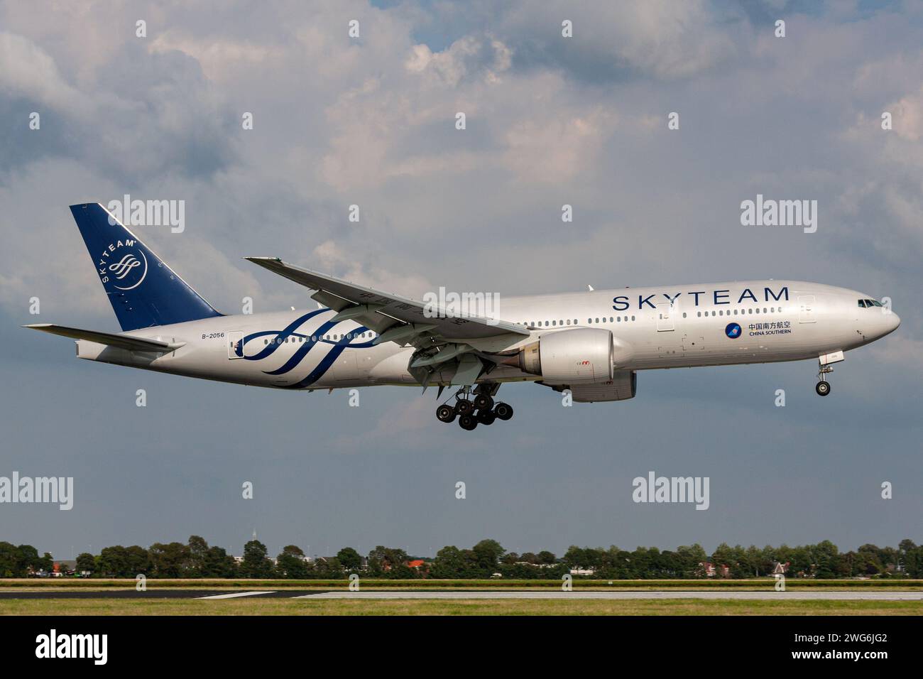 China Southern Airlines Boeing 777-200 with registration B-2056 in Skyteam livery on final for runway 18R (Polderbaan) of Amsterdam Airport Schiphol Stock Photo