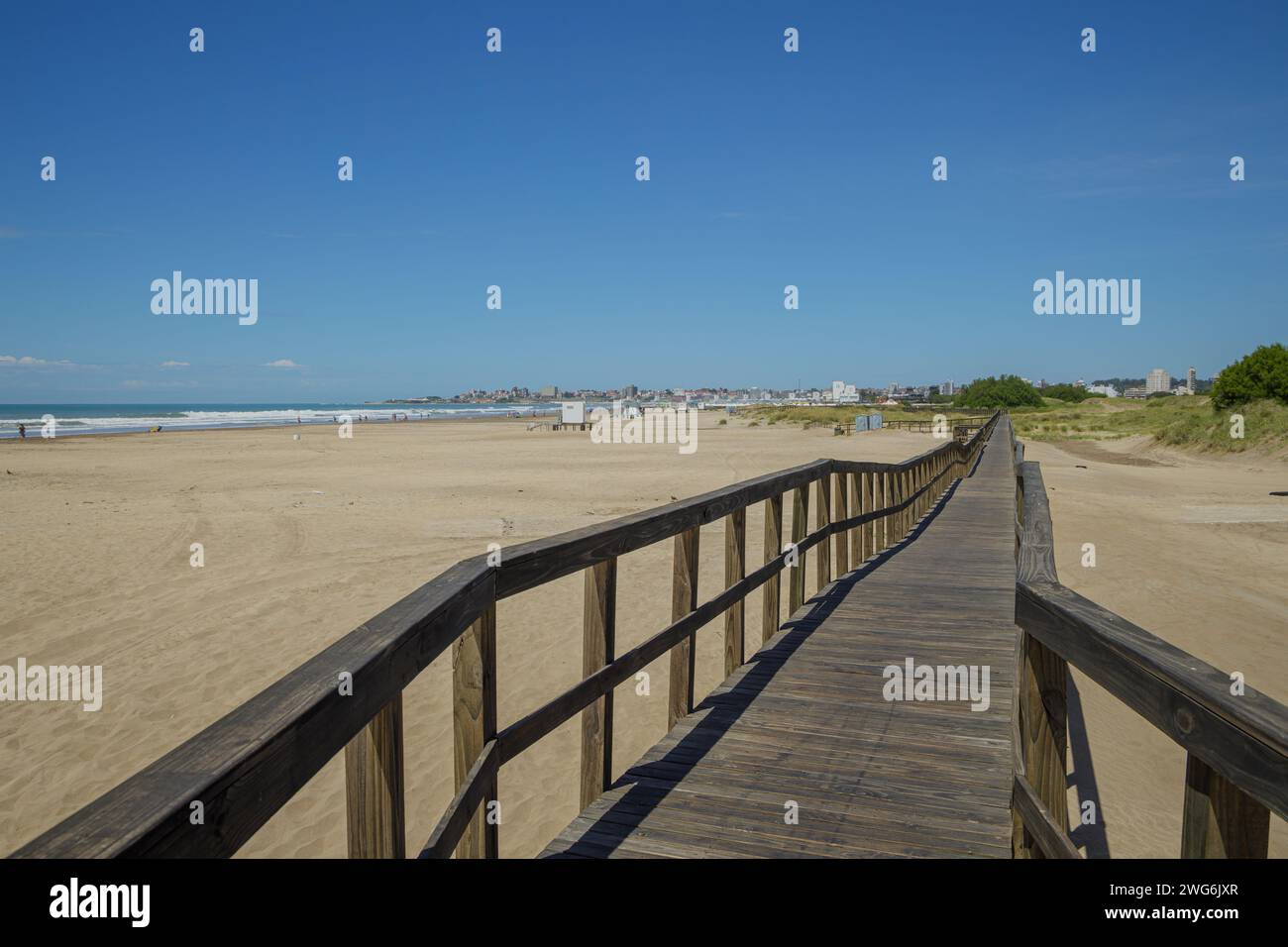 Wooden walkway on the beach of the port of Mar del Plata. Stock Photo