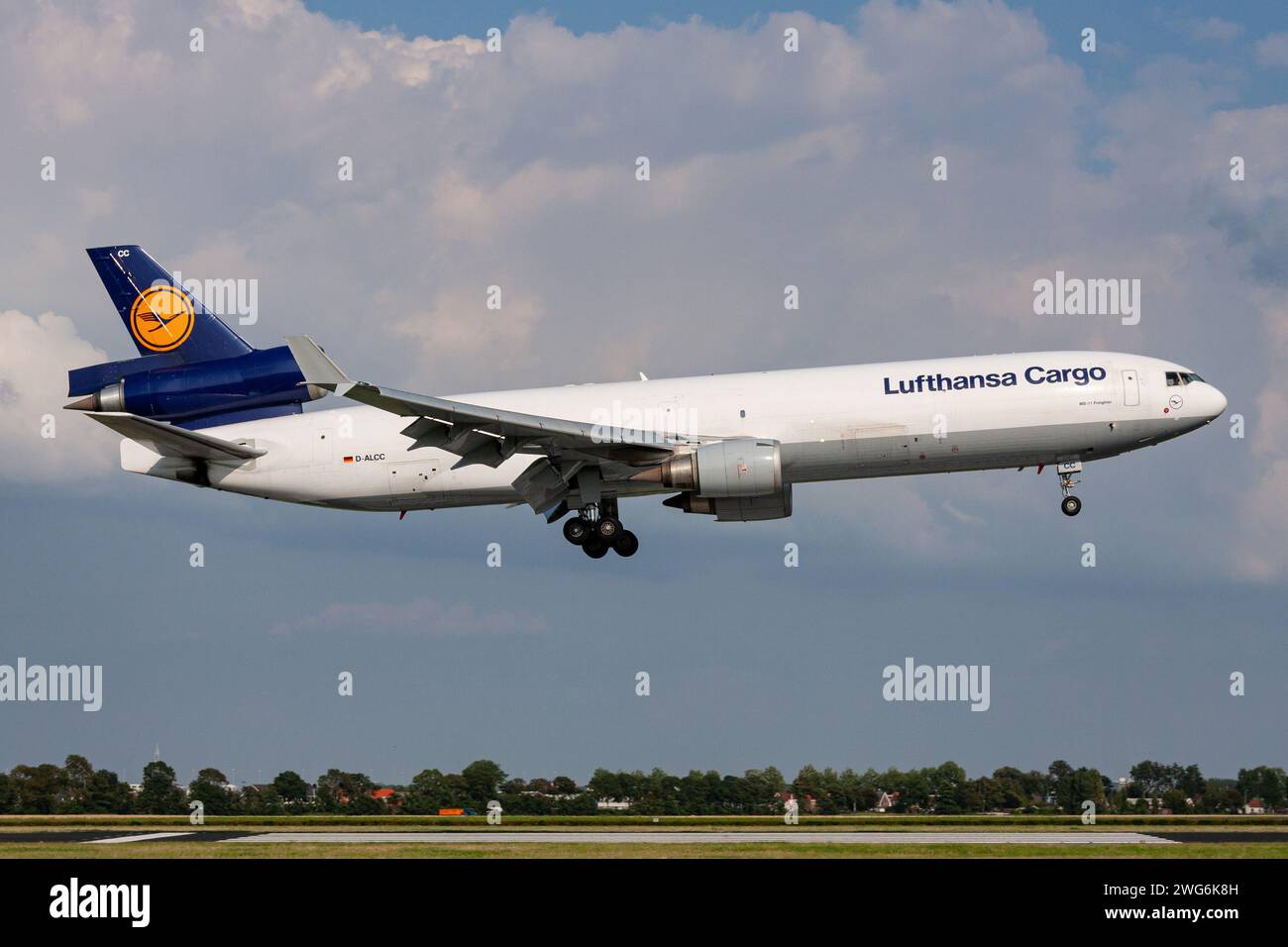 German Lufthansa Cargo McDonnell Douglas MD-11F with registration D-ALCC on short final for Amsterdam Airport Stock Photo