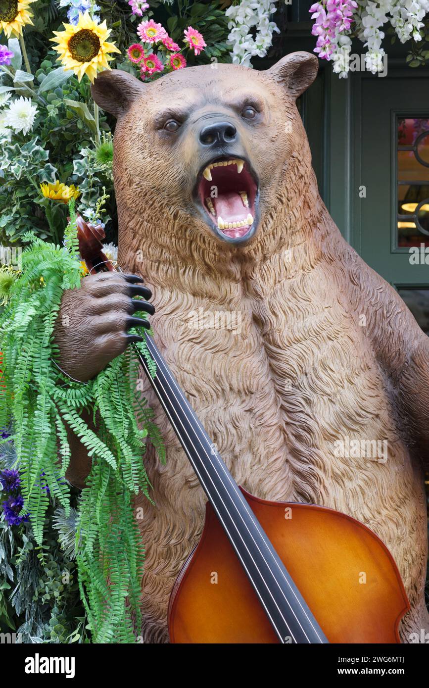 bear statue outside the ivy in london Stock Photo