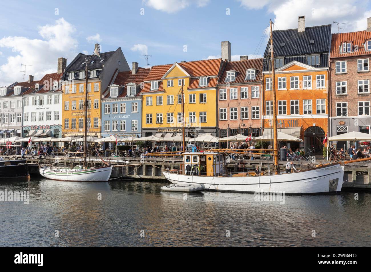 Nyhavn or New Harbour is a 17th-century harbour, canal and entertainment district in Copenhagen. Stock Photo