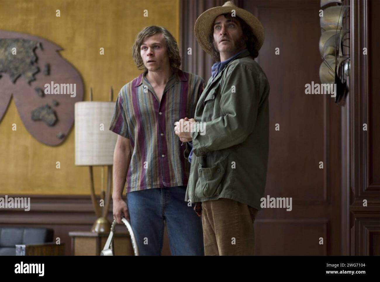 INHERENT VICE 2014  Warner Bros. Pictures film with Joaquin Phoenix at right as Larry 'Doc' Sportello and Jordan Christian Hearn as Denis Stock Photo