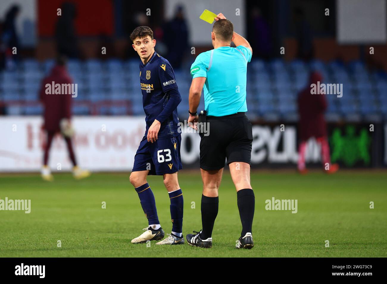 Dens Park, Dundee, UK. 3rd Feb, 2024. Scottish Premiership Football, Dundee versus Heart of Midlothian; Owen Beck of Dundee is booked for dissent by referee Graham Grainger after full time Credit: Action Plus Sports/Alamy Live News Stock Photo