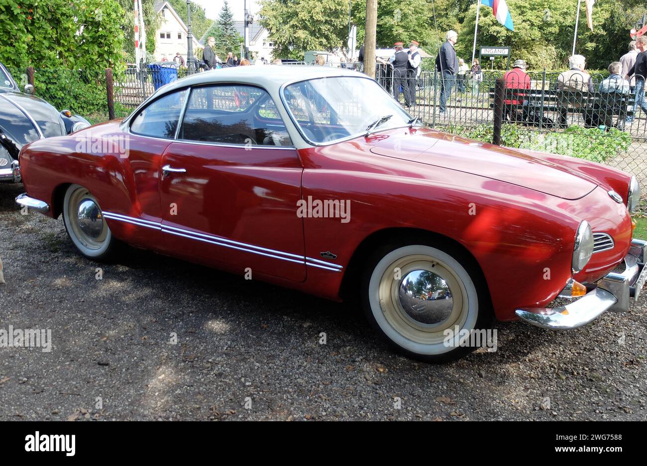 Loenen, Netherlands Sep 8 2019 - A red Volkswagen Karmann Ghia type 14 with whitewall tires is parked Stock Photo