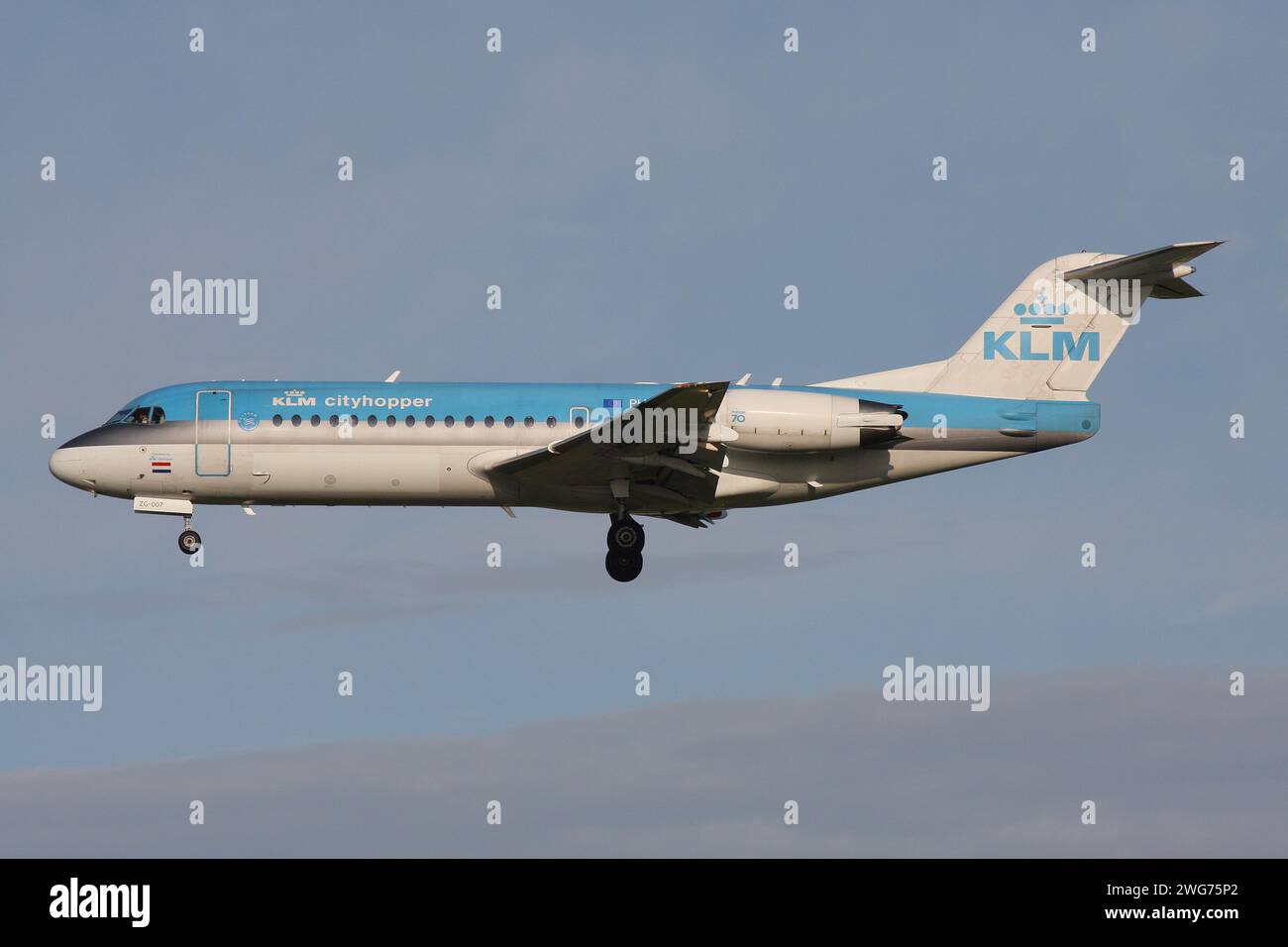 Dutch KLM Cityhopper Fokker 70 with registration PH-KZG on final for Amsterdam Airport Schiphol Stock Photo