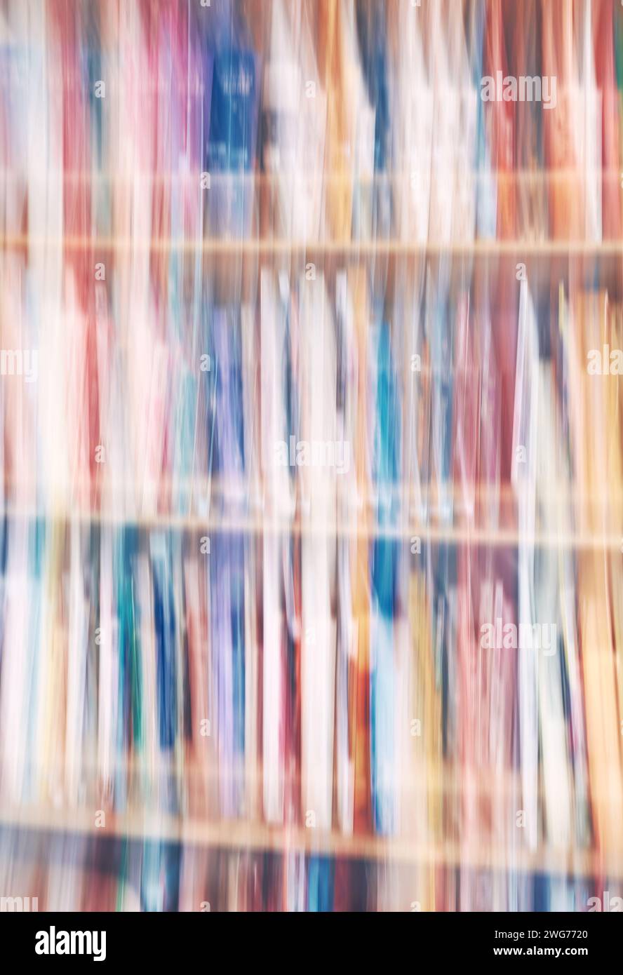 Motion blurred rows of books, abstract background. Stock Photo