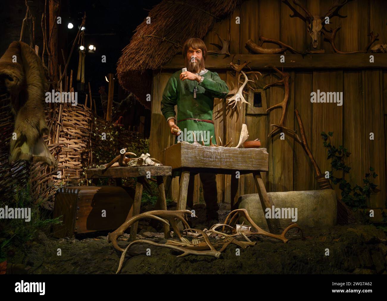 Jorvik Centre. An animatronic figure of a viking in the Jorvik Viking Centre, York, England. He is making items such as combs out of deer antlers. Stock Photo