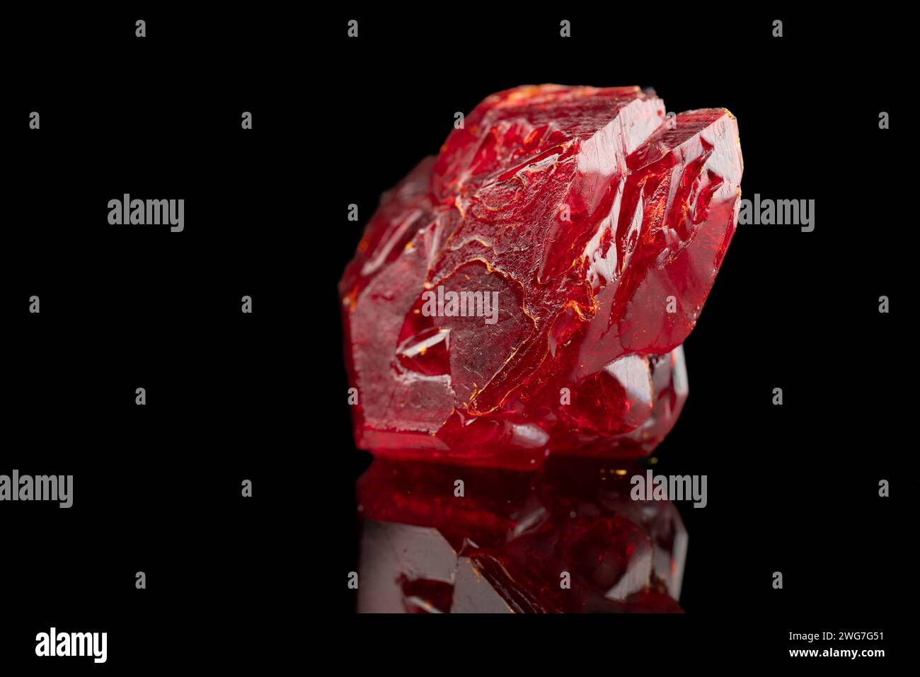 red mineral crystal on a black background Stock Photo