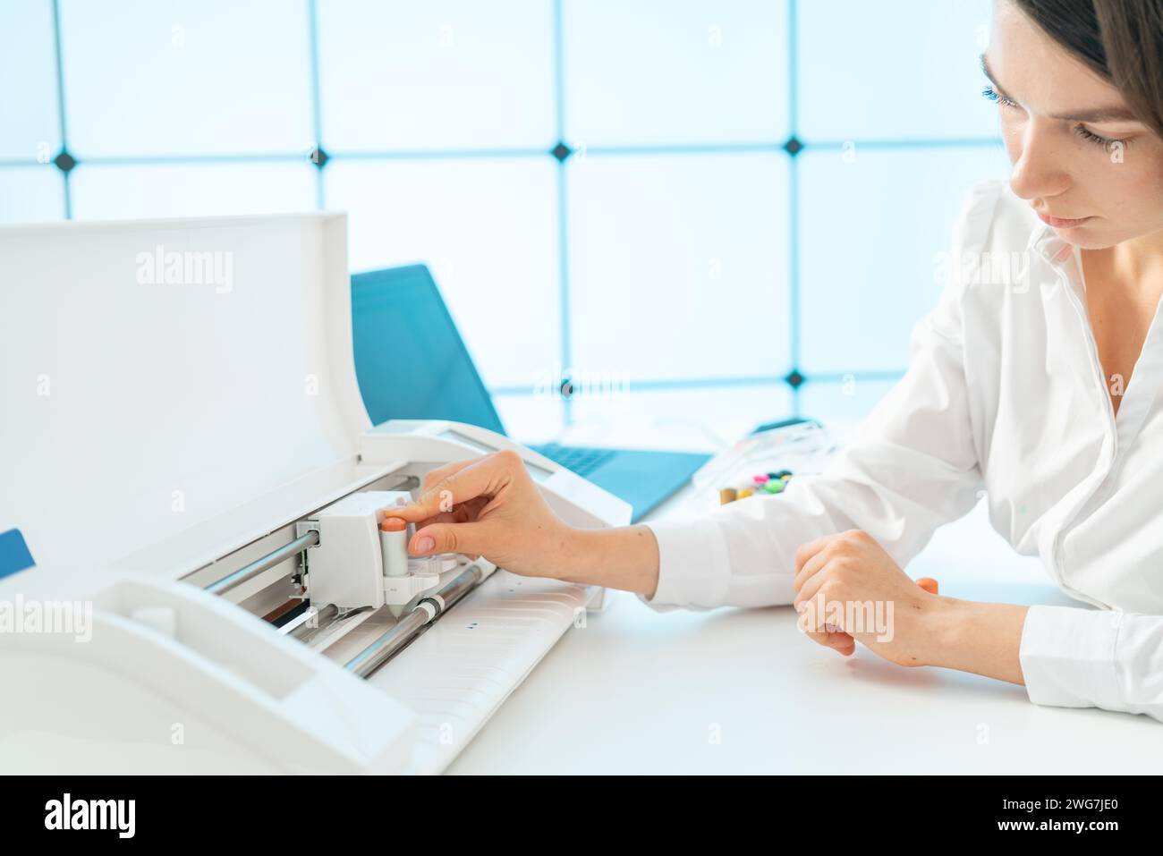 female office worker use plotter Stock Photo - Alamy