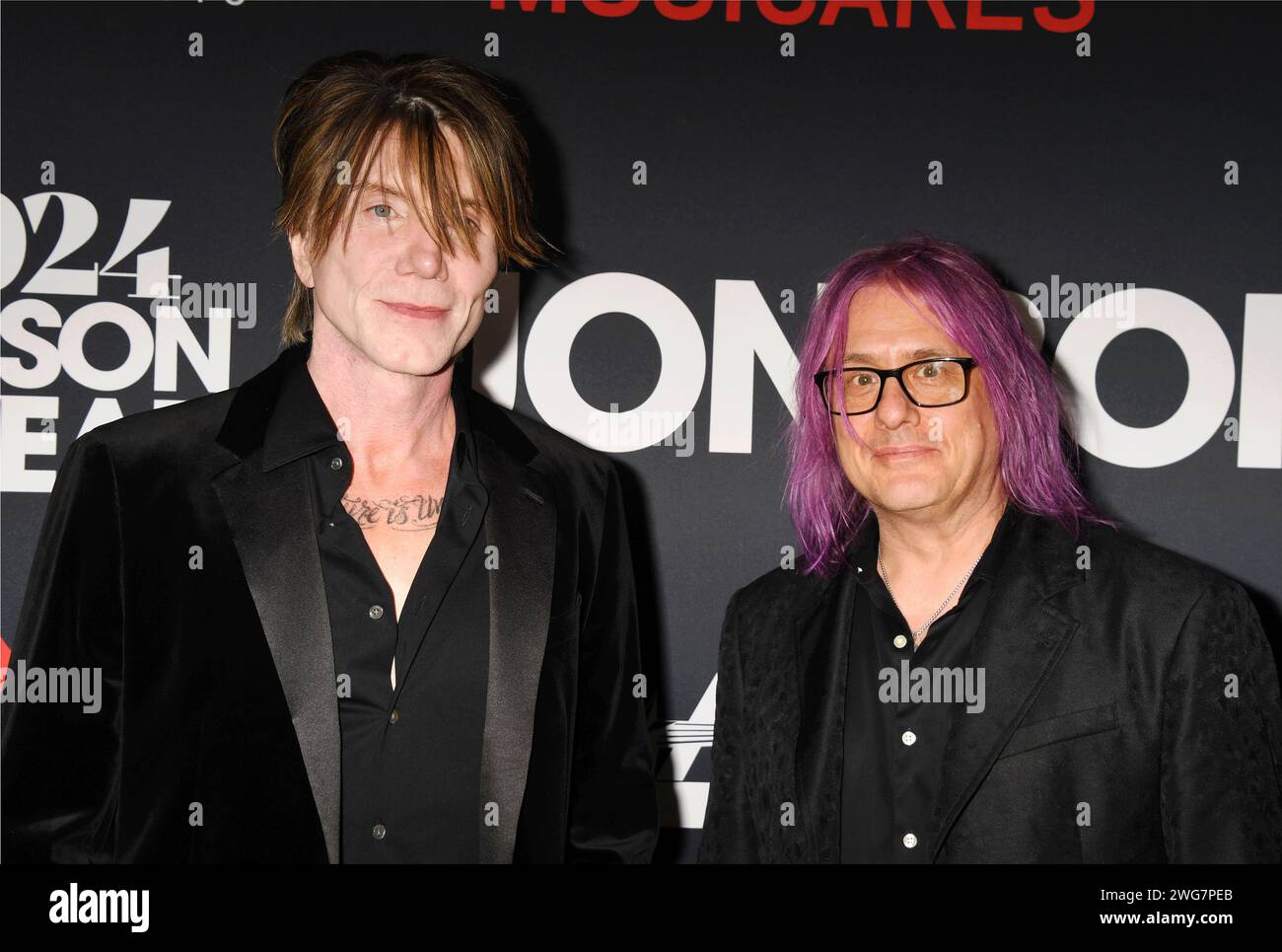 LOS ANGELES, CALIFORNIA - FEBRUARY 02: (L-R) John Rzeznik and Robby Takac of the Goo Goo Dolls attend the 2024 MusiCares Person of the Year Honoring J Stock Photo