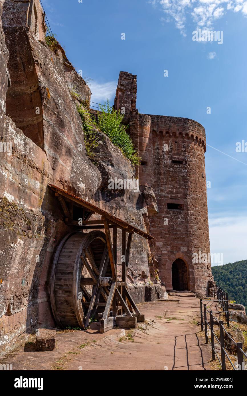 Erfweiler, Germany – August 30, 2023: Waterwheel and Tower of Castle Altdahnt in Dahner Felsenland, Rhineland-Palatinate. Stock Photo