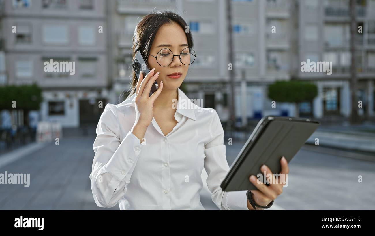 Multitasking young asian woman in hi-res stock photography and images ...