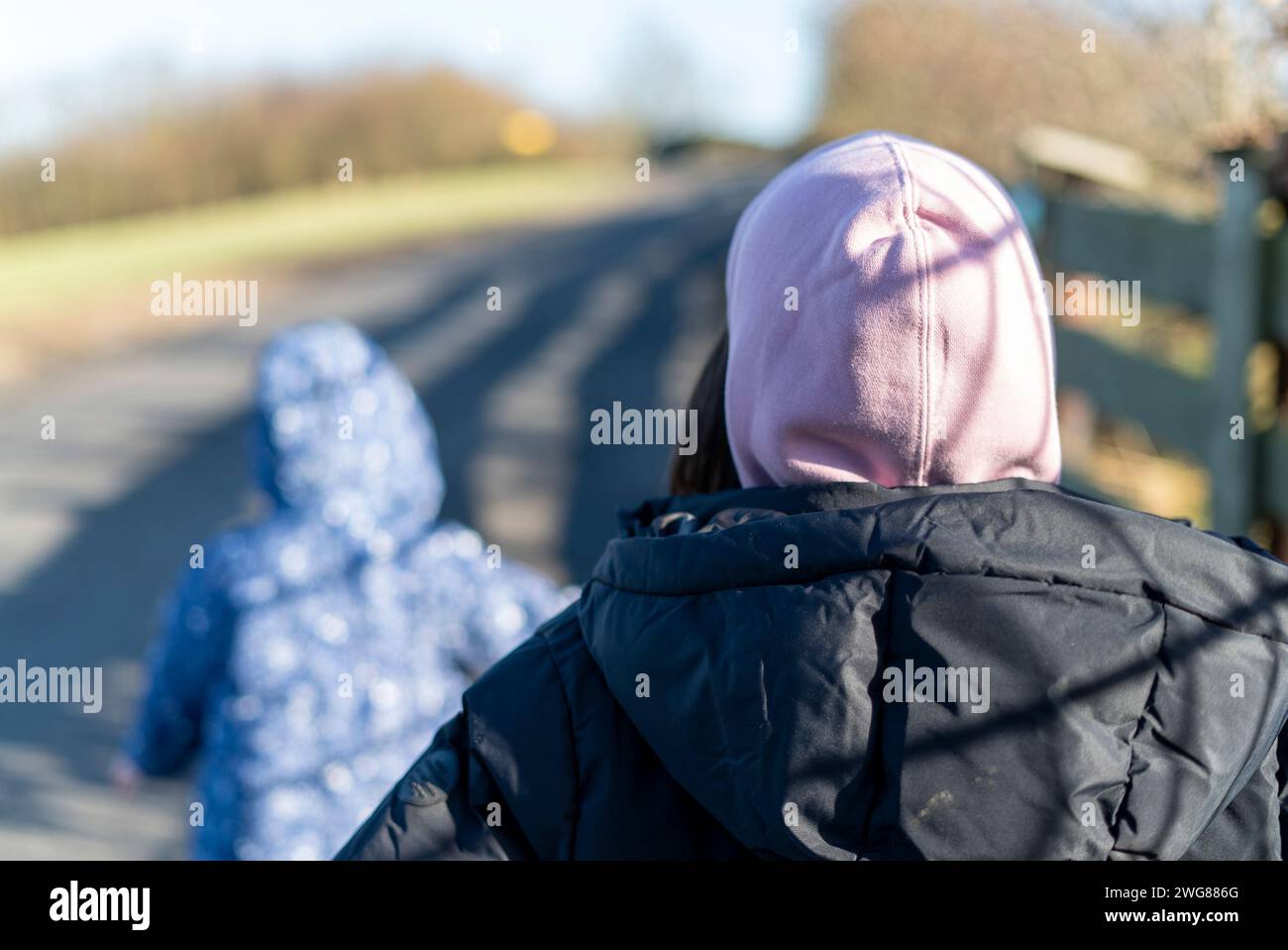 Two girls walking rear view hi-res stock photography and images - Alamy
