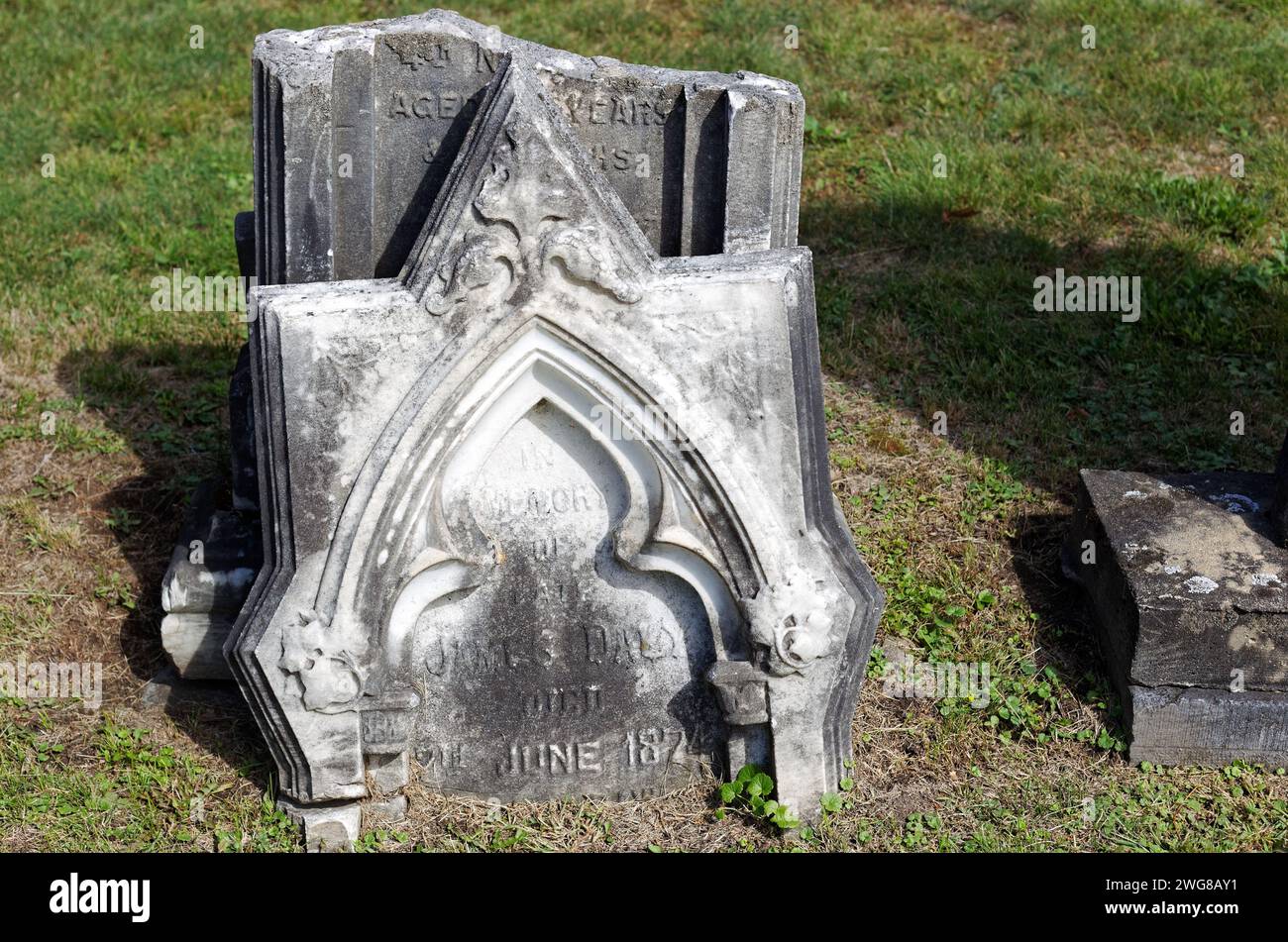 An old broken tombstone in a graveyard, Rawdon,Quebec,Canada Stock Photo
