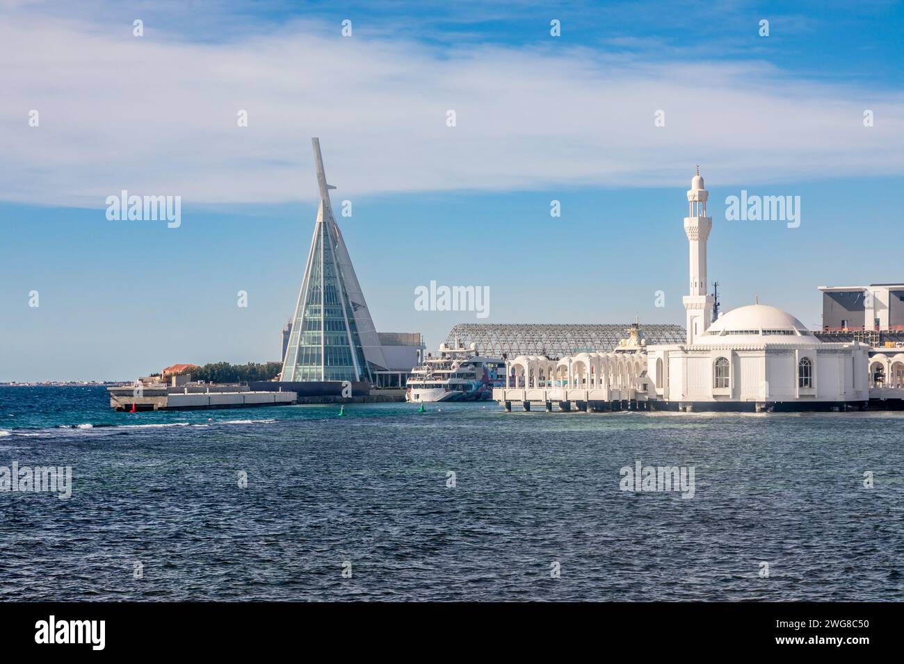 Alrahmah floating mosque with modern building and port and sea in foreground, Jeddah, Saudi Arabia Stock Photo