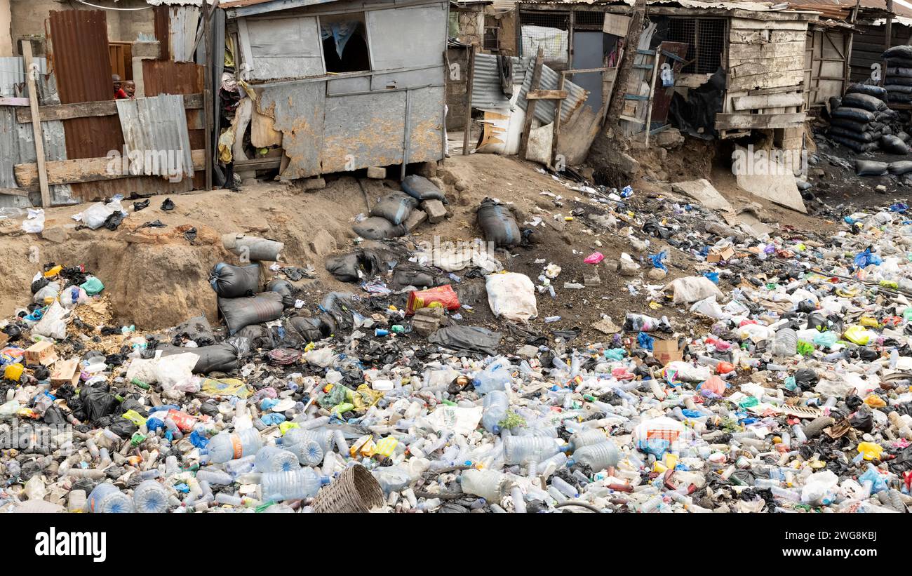 Poverty pollution Nina Accra Ghana neighborhood Africa. Toxic environment neighborhood. Health issue. Village polluted by trash, garbage and sewer. Stock Photo
