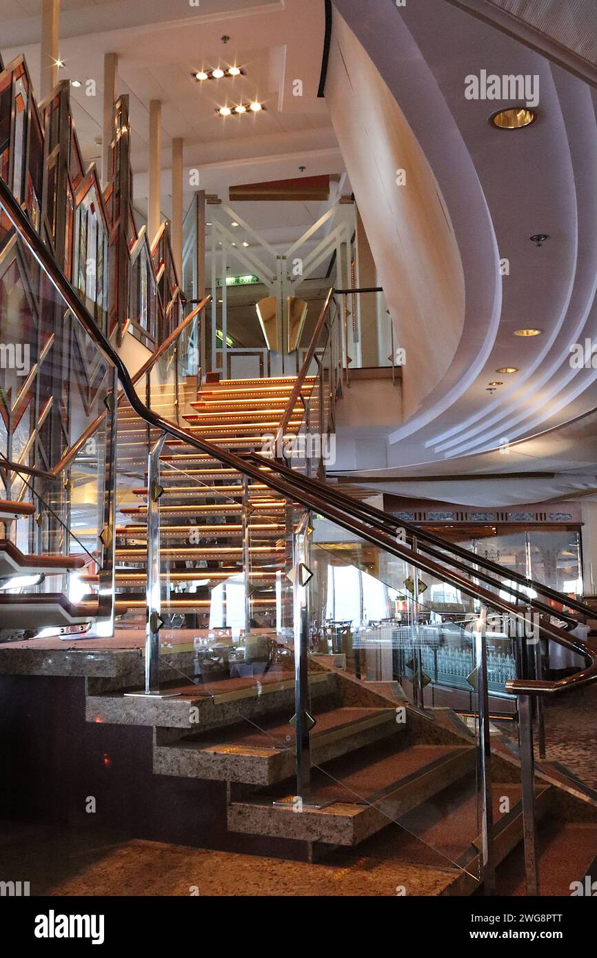 Spectacular “Y” shaped staircase leading to the Medina restaurant on the cruise ship Aurora, its interior design inspired by Moorish style and colours. Stock Photo