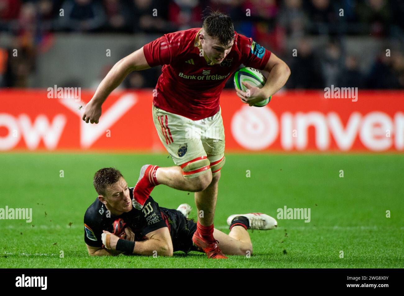 Ruadhan Quinn of Munster and Dallas McLeod of Crusaders during the test