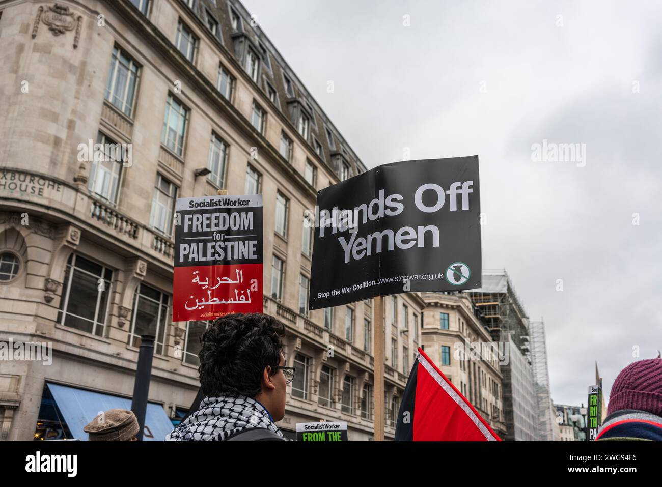 London, UK. 3rd February 2024. Freedom for Palestine and Hands off Yemen banners held by peace activists and protesters during the Pro - Palestine march through Oxford Street in Soho, Free Palestine Movement, London, UK Stock Photo