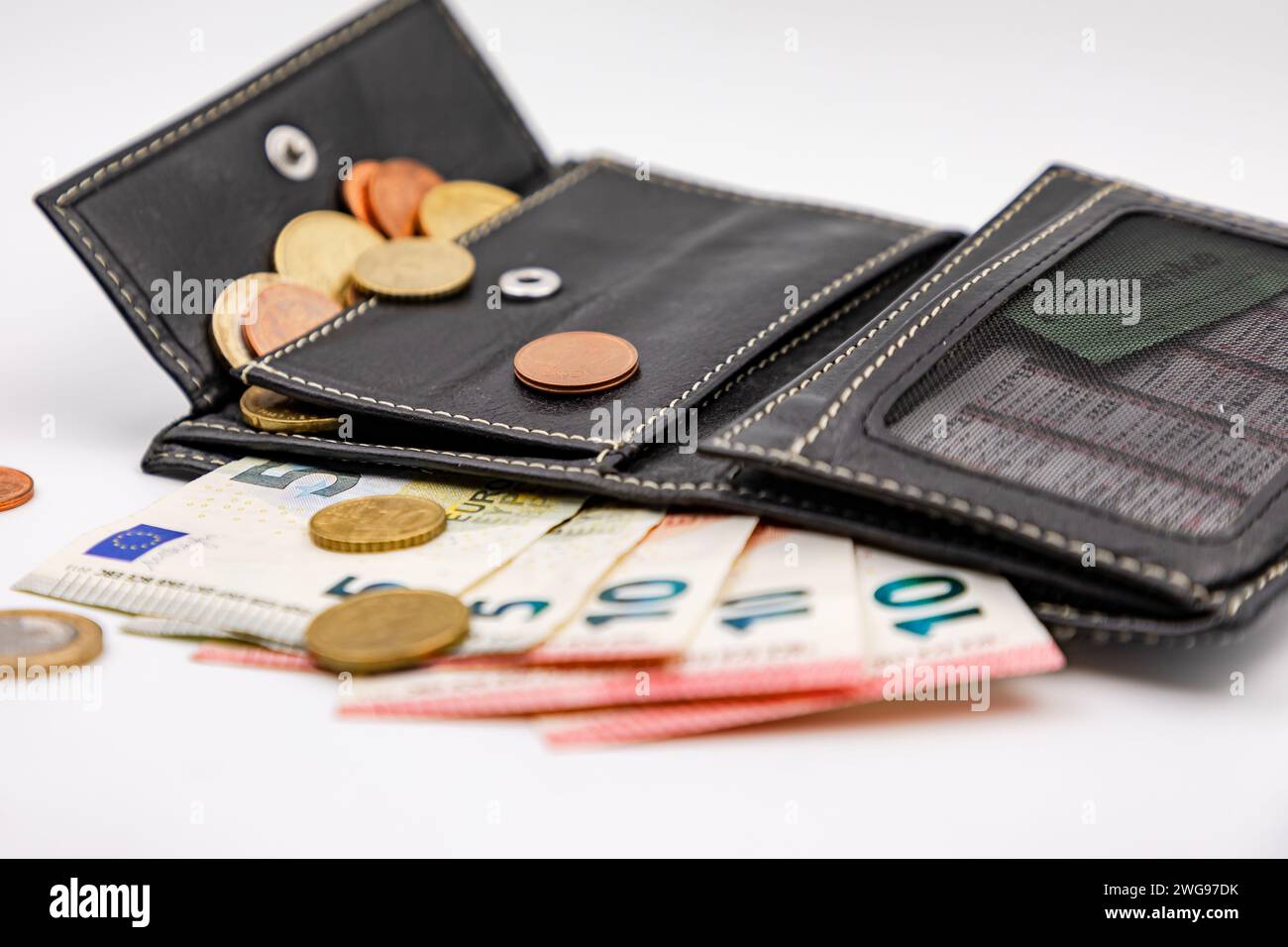 Coins and small bills in your wallet through subsidies help with rent and household costs Stock Photo