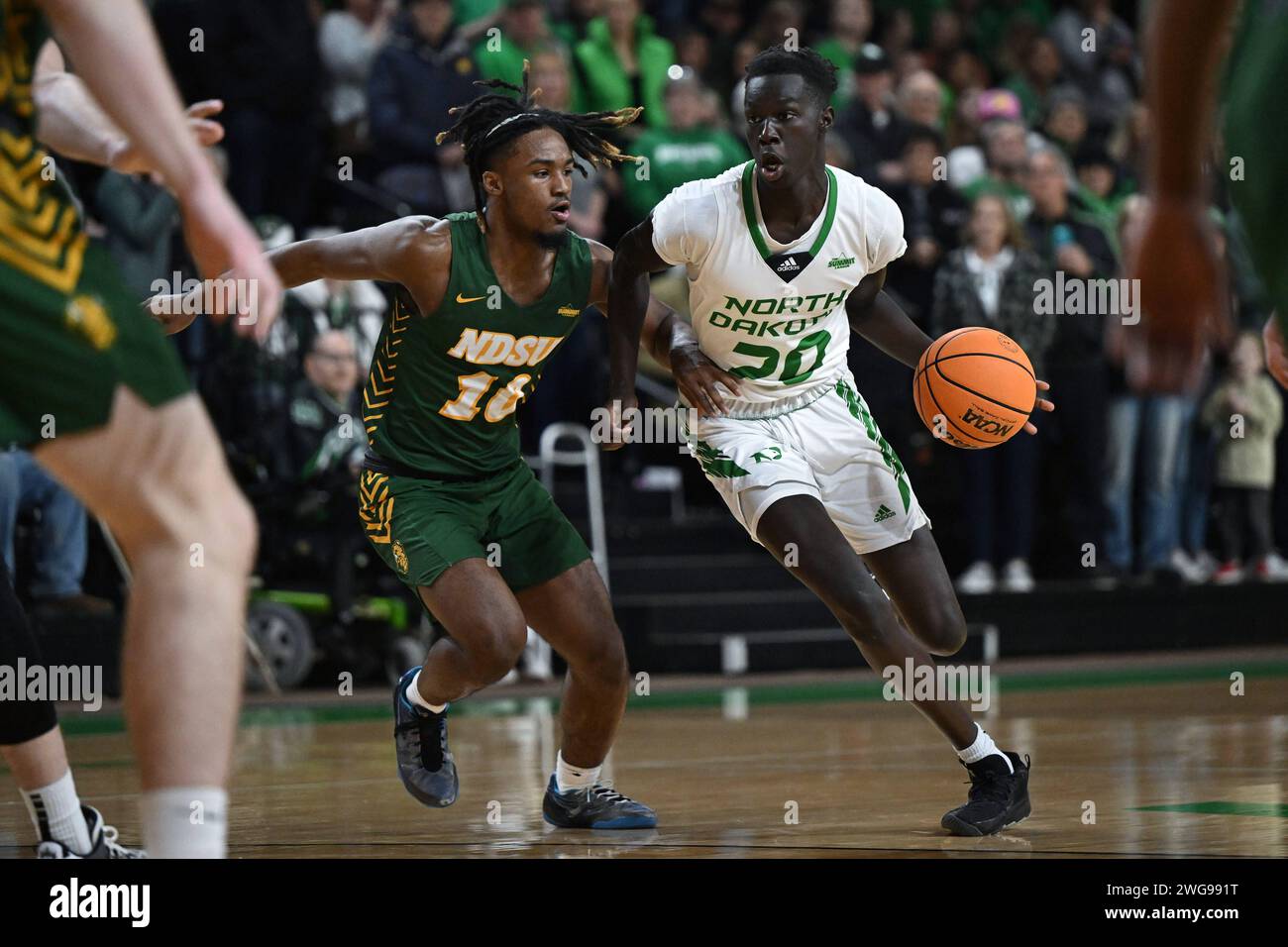 North Dakota Fighting Hawks forward B.J. Omot (20) drives to the basket during an NCAA men's Summit League basketball game between the North Dakota State Bison and the University of North Dakota Fighting Hawks at Betty Engelstad Sioux Center in Grand Forks, ND on Saturday, February 3, 2024. North Dakota won 60-58.Russell Hons/CSM (Credit Image: © Russell Hons/Cal Sport Media) Stock Photo