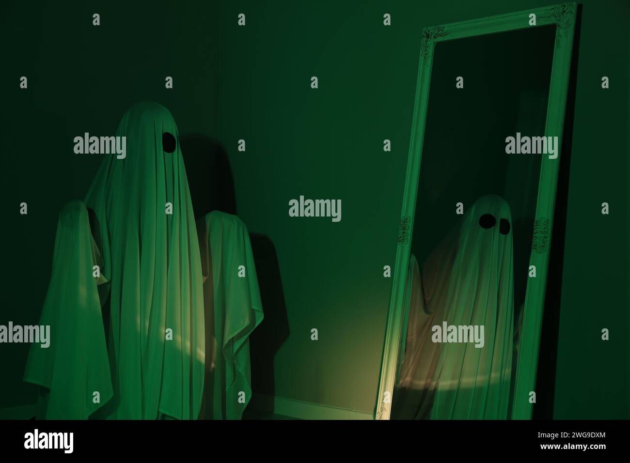 Woman looking dark mysterious figure hi-res stock photography and ...