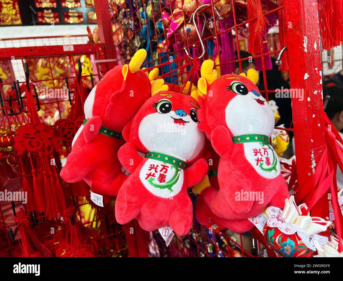 Singapore, Jan 2024. Chinatown, preparation to the Chinese New Year, with bright red and gold cute dragons for sale. Stock Photo