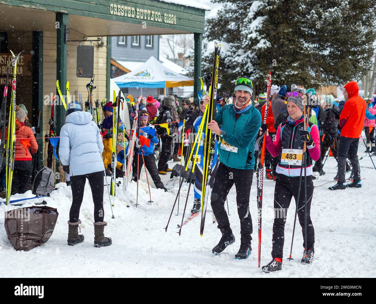 February 03, 2024 Nordic skiers gather near the finish line following