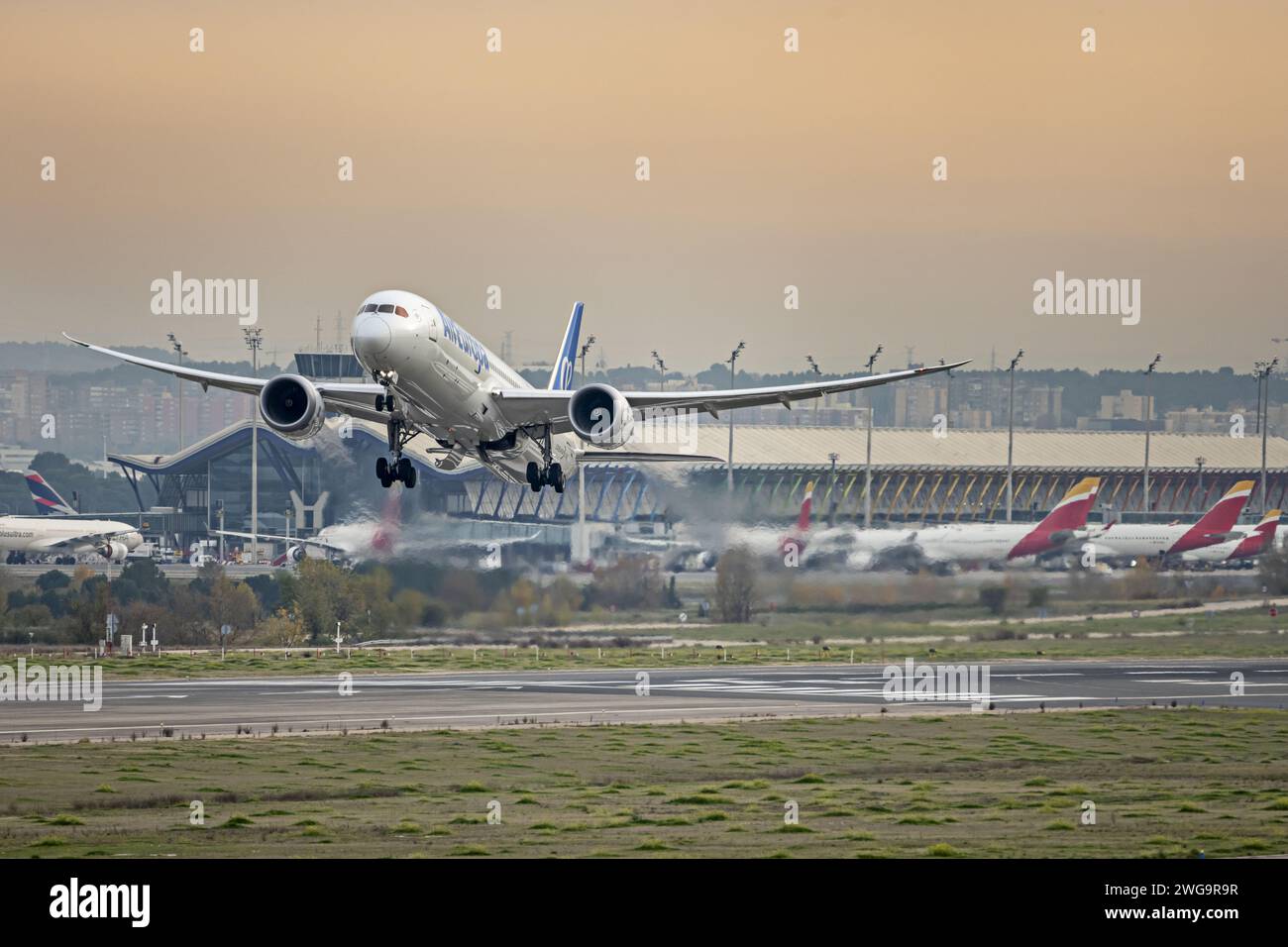 Engine at full power at takeoff of a passenger plane ascending to head to its destination Stock Photo