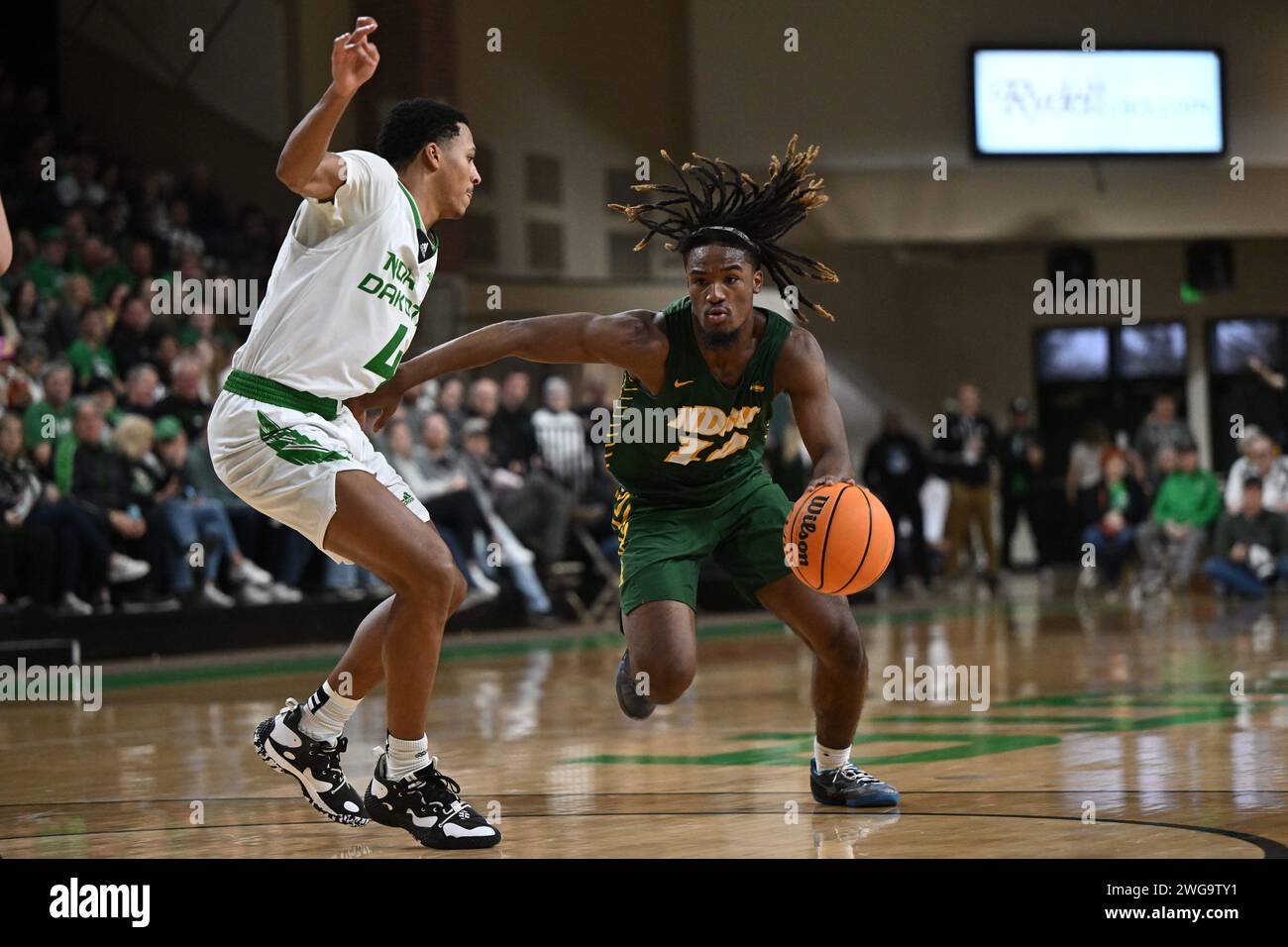 North Dakota State Bison guard Damari Wheeler-Thomas (10) drives to the basket while being defended by North Dakota Fighting Hawks guard Tyree Ihenacho (4) during an NCAA men's Summit League basketball game between the North Dakota State Bison and the University of North Dakota Fighting Hawks at Betty Engelstad Sioux Center in Grand Forks, ND on Saturday, February 3, 2024. North Dakota won 60-58.Russell Hons/CSM (Credit Image: © Russell Hons/Cal Sport Media) Stock Photo