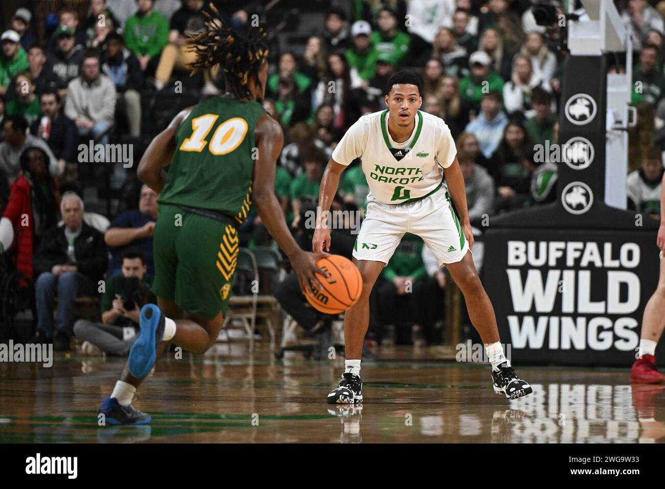 North Dakota Fighting Hawks guard Tyree Ihenacho (4) prepares to guard North Dakota State Bison guard Damari Wheeler-Thomas (10) as he brings the ball up the court during an NCAA men's Summit League basketball game between the North Dakota State Bison and the University of North Dakota Fighting Hawks at Betty Engelstad Sioux Center in Grand Forks, ND on Saturday, February 3, 2024. North Dakota won 60-58.Russell Hons/CSM Stock Photo