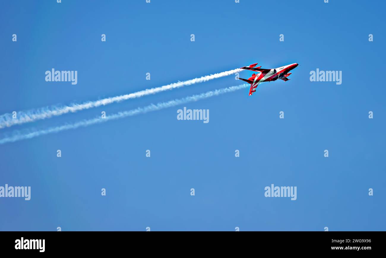 Indian Air Force's Surya Kiran Aerobatic Team plane performing upside