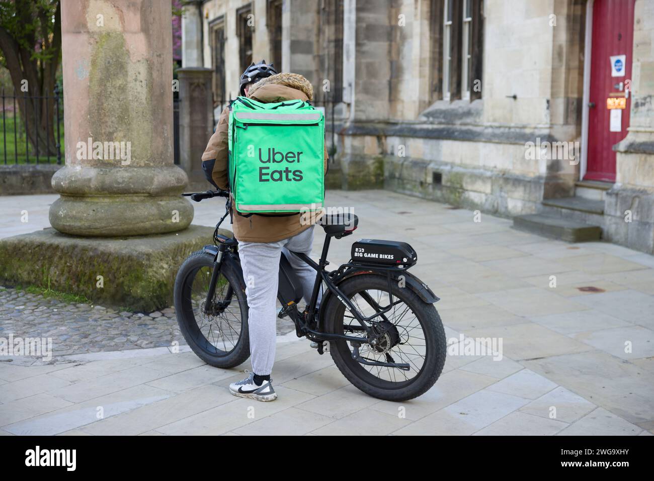 YORK, UK - April 17, 2023. Uber Eats delivery driver on a bicycle, York, UK. Food delivery gig economy. Stock Photo