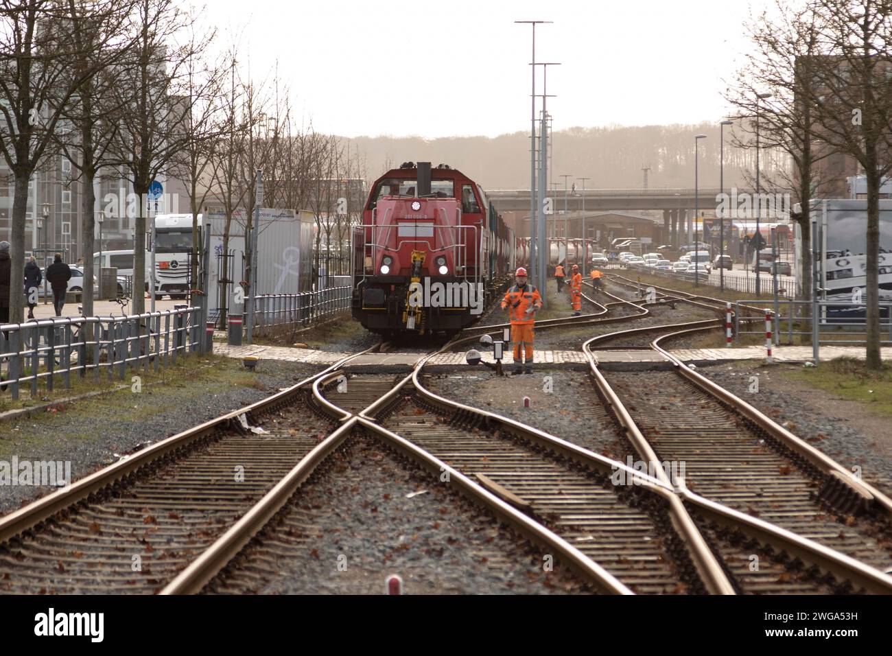 Symbolic image logistics, freight transport, railway tracks with locomotive and freight wagons of Deutsche Bahn in the harbour at Kiel Fjord, Baltic Stock Photo