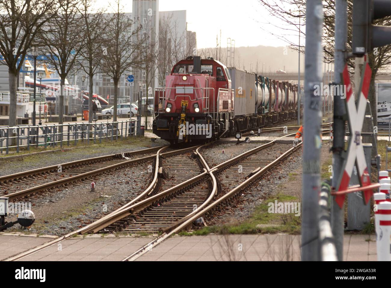 Symbolic image logistics, freight transport, railway tracks with locomotive and freight wagons of Deutsche Bahn in the harbour at Kiel Fjord, Baltic Stock Photo