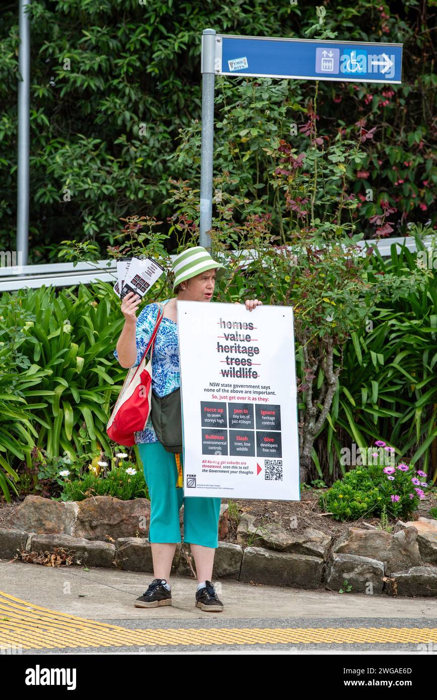 Former independent candidate for the Federal seat of Bradfield and recently the state seat of Davidson, Janine Kitson is seen here protesting at Gordon Station on Sydney's North Shore in Australia. Ms Kitson is upset, like many residents of the area at proposed rezoning of residential and commercial properties within a 400m range of the railway line by the Chris Minns led Labor State Government. Current single level dwellings, some in heritage zones are to be reclassified as 6-8 storey apartment blocks thereby hopefully reducing Sydney's housing deficit Stock Photo