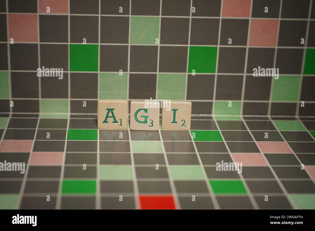 Wooden tile with green agi text on a blocked background Stock Photo
