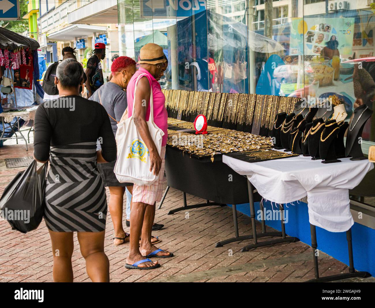 Shoppers at the SP Jewellery store on Bridge Street in downtown Castries, St. Lucia, Jan 2024. Stock Photo