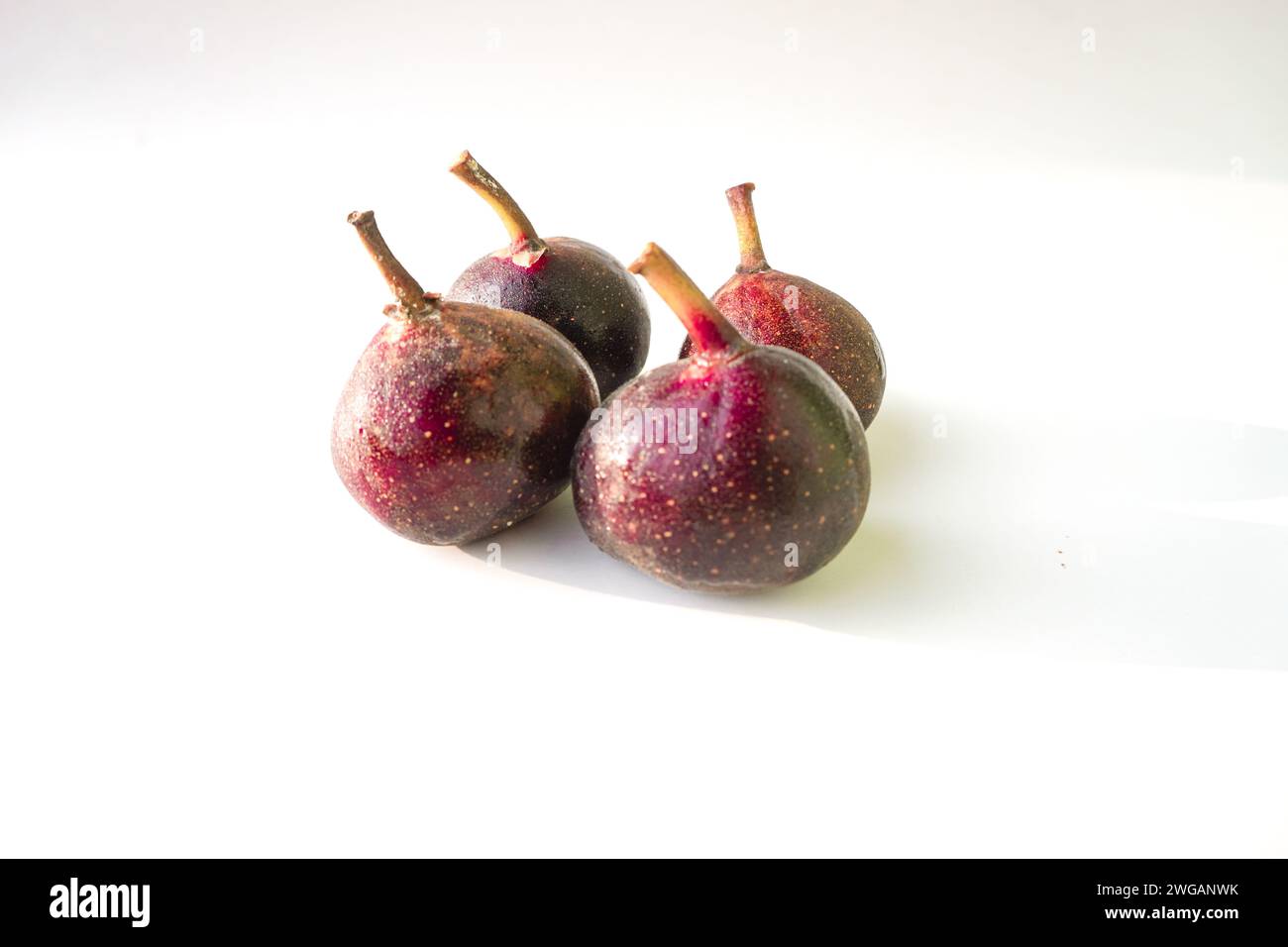 3 Ripe Figs Fresh and ripe figs isolated on white background Stock Photo - Alamy