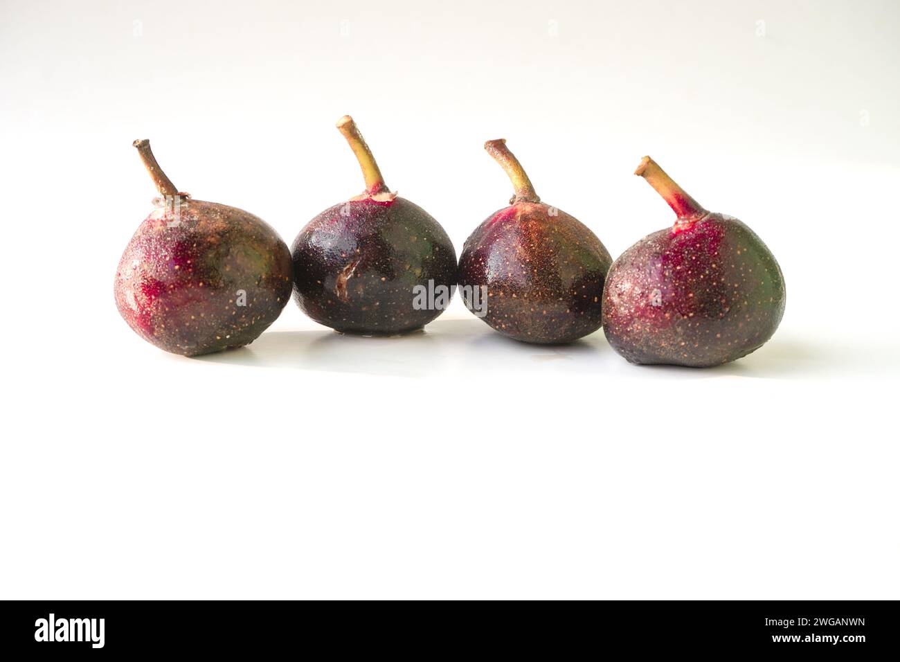 3 Ripe Figs Fresh and ripe figs isolated on white background Stock Photo - Alamy